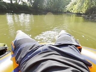 River jerkoff and piss on inflatable innertube